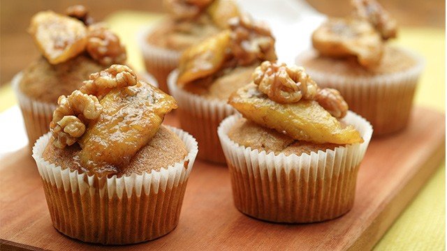 banana cupcakes topped with candied walnuts and fried banana