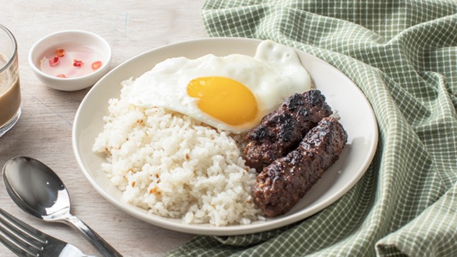 beef longganisa without any casing and made spicy on a plate with eggs and rice