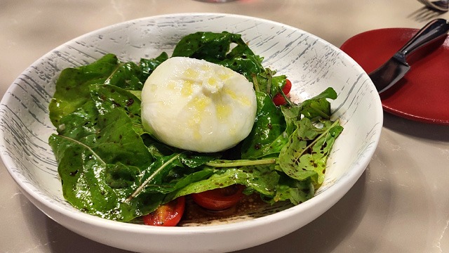 burrata cheese on top of rocket salad with balsamic vinegar and olive oil from il primo steakhouse in nustar cebu 