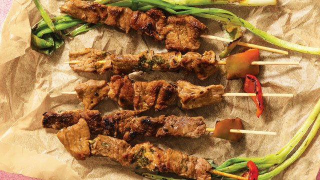 thai beef skewers on parchment paper