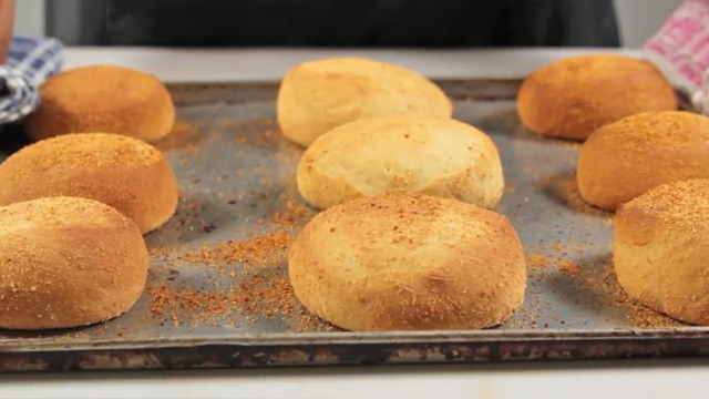 pandesal bread tinapay on a metal baking sheet 