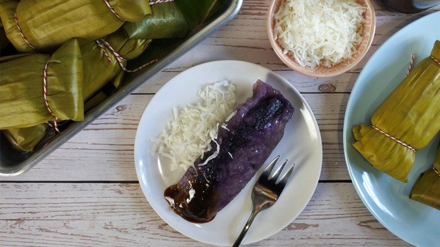 ube suman with latik or coco jam niyog or grated coconut on a plate