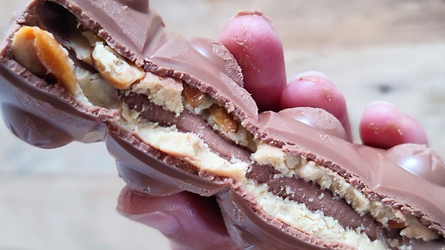 ludwig's choco fun peanut caramel crisp chocolate bar broken to reveal the inside