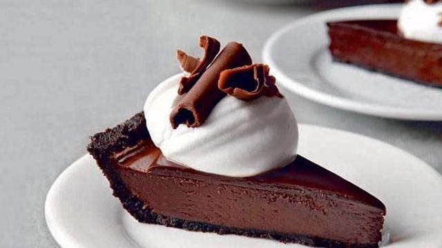a slice of dark chocolate truffle pie on a plate